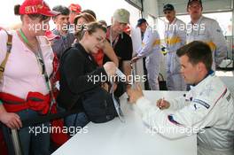 05.05.2006 Nürburg, Germany,  Dirk Müller, GER  signs autographs - Formula 1 World Championship, Rd 5, European Grand Prix, Friday, BMW Pit Lane Theme Park