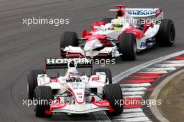 05.05.2006 Nürburg, Germany,  Takuma Sato (JPN), Super Aguri F1 and Ralf Schumacher (GER), Toyota Racing - Formula 1 World Championship, Rd 5, European Grand Prix, Friday Practice