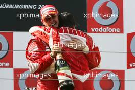 07.05.2006 Nürburg, Germany,  Michael Schumacher (GER), Scuderia Ferrari hugs Felipe Massa (BRA), Scuderia Ferrari - Formula 1 World Championship, Rd 5, European Grand Prix, Sunday Podium