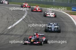 07.05.2006 Nürburg, Germany,  Scott Speed (USA), Scuderia Toro Rosso, STR01 leads Nico Rosberg (GER), WilliamsF1 Team, FW28 Cosworth - Formula 1 World Championship, Rd 5, European Grand Prix, Sunday Race