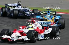 07.05.2006 Nürburg, Germany,  Ralf Schumacher (GER), Panasonic Toyota Racing TF106, leads Giancarlo Fisichella (ITA), Mild Seven Renault F1 R26 and Nico Rosberg (GER), WilliamsF1 Team FW28 - Formula 1 World Championship, Rd 5, European Grand Prix, Sunday Race