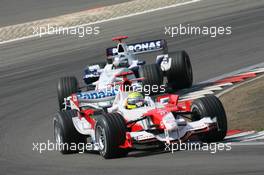 07.05.2006 Nürburg, Germany,  Ralf Schumacher (GER), Toyota Racing, TF106 leads Nick Heidfeld (GER), BMW Sauber F1 Team, F1.06 - Formula 1 World Championship, Rd 5, European Grand Prix, Sunday Race