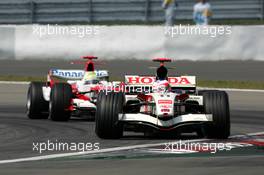 07.05.2006 Nürburg, Germany,  Rubens Barrichello (BRA), Lucky Strike Honda Racing F1 Team RA106, leads Ralf Schumacher (GER), Panasonic Toyota Racing TF106 - Formula 1 World Championship, Rd 5, European Grand Prix, Sunday Race