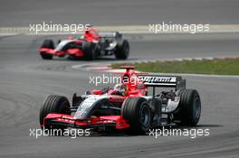 07.05.2006 Nürburg, Germany,  Tiago Monteiro (POR), Midland F1 Racing M16, leads Christijan Albers (NED), Midland F1 Racing M16 - Formula 1 World Championship, Rd 5, European Grand Prix, Sunday Race