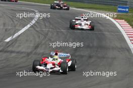 07.05.2006 Nürburg, Germany,  Ralf Schumacher (GER), Toyota Racing, TF106 leads Takuma Sato (JPN), Super Aguri F1, SA05 - Formula 1 World Championship, Rd 5, European Grand Prix, Sunday Race