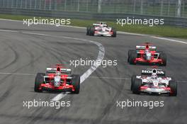 07.05.2006 Nürburg, Germany,  Tiago Monteiro (PRT), Midland MF1 Racing, Toyota M16 passes Takuma Sato (JPN), Super Aguri F1, SA05 - Formula 1 World Championship, Rd 5, European Grand Prix, Sunday Race