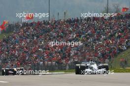 07.05.2006 Nürburg, Germany,  Nick Heidfeld (GER), BMW Sauber F1 Team, F1.06 leads Scott Speed (USA), Scuderia Toro Rosso, STR01 - Formula 1 World Championship, Rd 5, European Grand Prix, Sunday Race