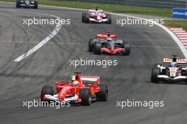07.05.2006 Nürburg, Germany,  Felipe Massa (BRA), Scuderia Ferrari, 248 F1 leads Jenson Button (GBR), Honda Racing F1 Team, RA106 - Formula 1 World Championship, Rd 5, European Grand Prix, Sunday Race