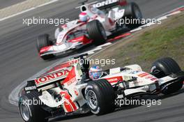 07.05.2006 Nürburg, Germany,  Jenson Button (GBR), Honda Racing F1 Team, RA106 leads Felipe Massa (BRA), Scuderia Ferrari, 248 F1 - Formula 1 World Championship, Rd 5, European Grand Prix, Sunday Race