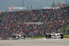 07.05.2006 Nürburg, Germany,  Takuma Sato (JPN), Super Aguri F1, SA05 in front of Ralf Schumacher (GER), Toyota Racing, TF106 - Formula 1 World Championship, Rd 5, European Grand Prix, Sunday Race