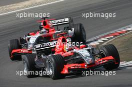 07.05.2006 Nürburg, Germany,  Tiago Monteiro (PRT), Midland MF1 Racing, Toyota M16 leads Christijan Albers (NED), Midland MF1 Racing, Toyota M16 - Formula 1 World Championship, Rd 5, European Grand Prix, Sunday Race