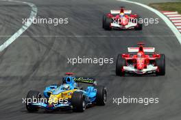 07.05.2006 Nürburg, Germany,  Fernando Alonso (ESP), Renault F1 Team, in the new R26 leads Michael Schumacher (GER), Scuderia Ferrari, F2006 and Felipe Massa (BRA), Scuderia Ferrari - Formula 1 World Championship, Rd 5, European Grand Prix, Sunday Race