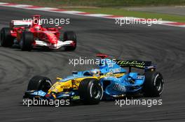 07.05.2006 Nürburg, Germany,  Fernando Alonso (ESP), Mild Seven Renault F1 R26, leading Michael Schumacher (GER), Scuderia Ferrari Marlboro 248 F1, in the early stages of the race - Formula 1 World Championship, Rd 5, European Grand Prix, Sunday Race