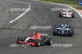 07.05.2006 Nürburg, Germany,  Christijan Albers (NED), Midland MF1 Racing, Toyota M16 leads Nico Rosberg (GER), WilliamsF1 Team, FW28 Cosworth - Formula 1 World Championship, Rd 5, European Grand Prix, Sunday Race