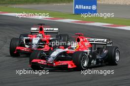 07.05.2006 Nürburg, Germany,  Tiago Monteiro (POR), Midland F1 Racing M16, leads Christijan Albers (NED), Midland F1 Racing M16 - Formula 1 World Championship, Rd 5, European Grand Prix, Sunday Race