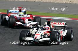 07.05.2006 Nürburg, Germany,  Rubens Barrichello (BRA), Lucky Strike Honda Racing F1 Team RA106, leads Ralf Schumacher (GER), Panasonic Toyota Racing TF106 - Formula 1 World Championship, Rd 5, European Grand Prix, Sunday Race
