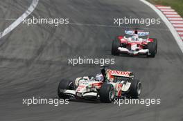 07.05.2006 Nürburg, Germany,  Jenson Button (GBR), Honda Racing F1 Team, RA106 leads Jarno Trulli (ITA), Toyota Racing, TF106 - Formula 1 World Championship, Rd 5, European Grand Prix, Sunday Race