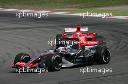 06.05.2006 Nürburg, Germany,  Juan-Pablo Montoya (COL), Juan Pablo, McLaren Mercedes, MP4-21 leads Michael Schumacher (GER), Scuderia Ferrari, 248 F1 - Formula 1 World Championship, Rd 5, European Grand Prix, Saturday Qualifying