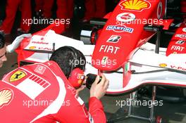 06.05.2006 Nürburg, Germany,  Ferrari mechanic is taking a photo of the front wing - Formula 1 World Championship, Rd 5, European Grand Prix, Saturday Practice