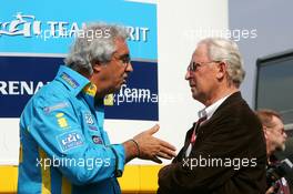 07.05.2006 Nürburg, Germany,  Flavio Briatore (ITA), Managing Director Renault F1 Team (left), talking with Prof. Jürgen Hubbert (GER), Board of Management DaimlerChrysler (right) - Formula 1 World Championship, Rd 5, European Grand Prix, Sunday