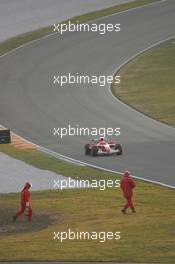 24.01.2006 Mugello, Italy,  Michael Schumacher (GER), Scuderia Ferrari was rolling in the Pit lane after a technical problem which started before the last corner, the engine was still running  - Scuderia Ferrari 248 F1 Launch and testing