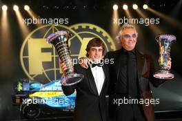 08.12.2006 Monte Carlo, Monaco,  Fernando Alonso (ESP) and Flavio Briatore (ITA), Renault F1 Team, Team Chief, Managing Director, with their Drivers Championship and Constructors Championship trophies, respectively - 2006 FIA Gala Prize Giving Ceremony