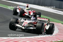 14.07.2006 Magny Cours, France,  Jenson Button (GBR), Honda Racing F1 Team, RA106 and Ralf Schumacher (GER), Toyota Racing, TF106 - Formula 1 World Championship, Rd 11, French Grand Prix, Friday Practice