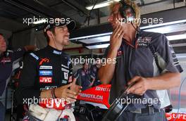 14.07.2006 Magny Cours, France,  Tiago Monteiro (POR), Midland F1 Racing, Portrait, talking with an engineer - Formula 1 World Championship, Rd 11, French Grand Prix, Friday Practice