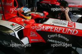 14.07.2006 Magny Cours, France,  Adrian Sutil (GER), Test Driver, Midland MF1 Racing, Toyota M16, prepares for Free Practice - Formula 1 World Championship, Rd 11, French Grand Prix, Friday Practice