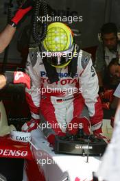 14.07.2006 Magny Cours, France,  Ralf Schumacher (GER), Toyota Racing TF106, stepping into the car - Formula 1 World Championship, Rd 11, French Grand Prix, Friday Practice