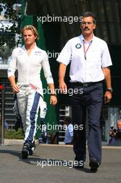 14.07.2006 Magny Cours, France,  Dr. Mario Theissen (GER), BMW Sauber F1 Team, BMW Motorsport Director and Nico Rosberg (GER), WilliamsF1 Team - Formula 1 World Championship, Rd 11, French Grand Prix, Friday