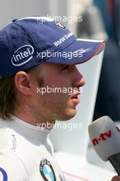 14.07.2006 Magny Cours, France,  Nick Heidfeld (GER), BMW Sauber F1 Team, Portrait, being interviewed by N-TV - Formula 1 World Championship, Rd 11, French Grand Prix, Friday Practice