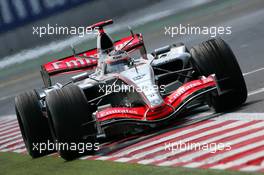 14.07.2006 Magny Cours, France,  Kimi Raikkonen (FIN), Team West McLaren Mercedes MP4-21 - Formula 1 World Championship, Rd 11, French Grand Prix, Friday Practice