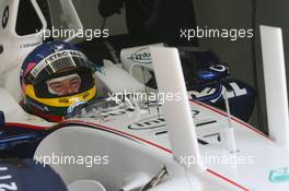 14.07.2006 Magny Cours, France,  Jacques Villeneuve (CDN), BMW Sauber F1 Team, F1.06, stares at the new Aerodynamic devices on the car this weekend - Formula 1 World Championship, Rd 11, French Grand Prix, Friday Practice