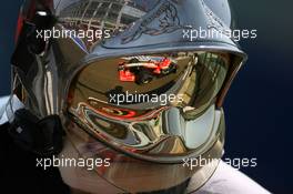 14.07.2006 Magny Cours, France,  Christijan Albers (NED), Midland MF1 Racing, Toyota M16, Reflection in a Fire Marshalls helmet - Formula 1 World Championship, Rd 11, French Grand Prix, Friday Practice