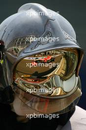 14.07.2006 Magny Cours, France,  Adrian Sutil (GER), Test Driver, Midland MF1 Racing, Toyota M16, Reflection in a Fire Marshalls helmet - Formula 1 World Championship, Rd 11, French Grand Prix, Friday Practice