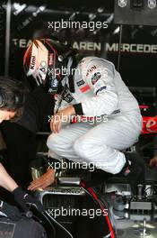 14.07.2006 Magny Cours, France,  Kimi Raikkonen (FIN), Team West McLaren Mercedes MP4-21, climbing out of his car - Formula 1 World Championship, Rd 11, French Grand Prix, Friday Practice