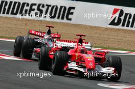 14.07.2006 Magny Cours, France,  Michael Schumacher (GER), Scuderia Ferrari 248 F1, in front of Kimi Raikkonen (FIN), Team West McLaren Mercedes MP4-21 - Formula 1 World Championship, Rd 11, French Grand Prix, Friday Practice