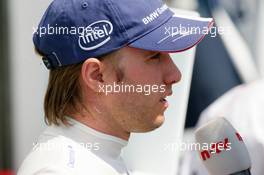 14.07.2006 Magny Cours, France,  Nick Heidfeld (GER), BMW Sauber F1 Team, Portrait, being interviewed for N-TV - Formula 1 World Championship, Rd 11, French Grand Prix, Friday Practice