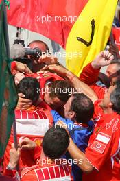 16.07.2006 Magny Cours, France,  1st place, Michael Schumacher (GER), Scuderia Ferrari celebrates with the team  - Formula 1 World Championship, Rd 11, French Grand Prix, Sunday Podium