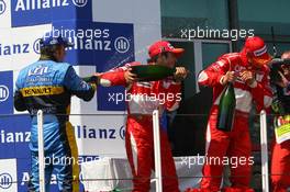 16.07.2006 Magny Cours, France,  1st place Michael Schumacher (GER), Scuderia Ferrari, 2nd place Fernando Alonso (ESP), Renault F1 Team, 3rd place Felipe Massa (BRA), Scuderia Ferrari - Formula 1 World Championship, Rd 11, French Grand Prix, Sunday Podium