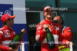 16.07.2006 Magny Cours, France,  1st place Michael Schumacher (GER), Scuderia Ferrari,  3rd place Felipe Massa (BRA), Scuderia Ferrari - Formula 1 World Championship, Rd 11, French Grand Prix, Sunday Podium