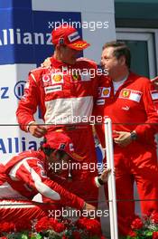 16.07.2006 Magny Cours, France,  1st place Michael Schumacher (GER), Scuderia Ferrari,  3rd place Felipe Massa (BRA), Scuderia Ferrari, and Jean Todt (FRA), Scuderia Ferrari, Teamchief, General Manager, Team Principal - Formula 1 World Championship, Rd 11, French Grand Prix, Sunday Podium