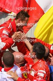 16.07.2006 Magny Cours, France,  1st place, Michael Schumacher (GER), Scuderia Ferrari celebrates with the team  - Formula 1 World Championship, Rd 11, French Grand Prix, Sunday Podium