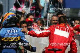 16.07.2006 Magny Cours, France,  Fernando Alonso (ESP), Renault F1 Team, and Michael Schumacher (GER), Scuderia Ferrari - Formula 1 World Championship, Rd 11, French Grand Prix, Sunday Podium