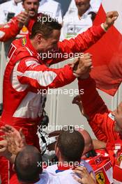 16.07.2006 Magny Cours, France,  1st place, Michael Schumacher (GER), Scuderia Ferrari celebrates with the team  - Formula 1 World Championship, Rd 11, French Grand Prix, Sunday Podium