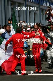 16.07.2006 Magny Cours, France,  Jean Todt (FRA), Team Manager Scuderia Ferrari Marlboro, congratulates Michael Schumacher (GER), Scuderia Ferrari, Portrait (1st) - Formula 1 World Championship, Rd 11, French Grand Prix, Sunday Podium