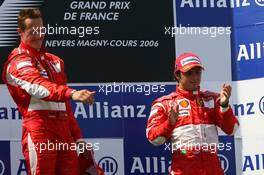 16.07.2006 Magny Cours, France,  1st place Michael Schumacher (GER), Scuderia Ferrari,  3rd place Felipe Massa (BRA), Scuderia Ferrari - Formula 1 World Championship, Rd 11, French Grand Prix, Sunday Podium