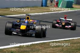 16.07.2006 Magny Cours, France,  Christian Klien (AUT), Red Bull Racing RB2, leads Vitantonio Liuzzi (ITA), Scuderia Toro Rosso STR 01 - Formula 1 World Championship, Rd 11, French Grand Prix, Sunday Race