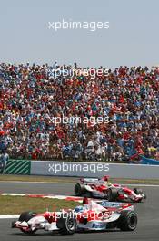 16.07.2006 Magny Cours, France,  Jarno Trulli (ITA), Toyota Racing, TF106 and Ralf Schumacher (GER), Toyota Racing, TF106 - Formula 1 World Championship, Rd 11, French Grand Prix, Sunday Race